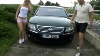 Spicy busty blonde is getting fucked on a car